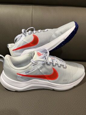 Nike Light Gray Sneakers with Red Swoosh
